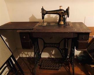 Singer treadle sewing machine with cabinet and cast iron stand