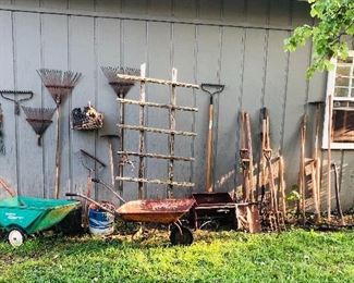 Lots of yard tools,  wheelbarrows , trellises and buckets