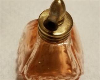 Pink  bottle with brass top as shown $25
