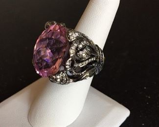Massive and beautiful morganite main gemstone accented with sapphires and tsavorite set in 18k gold.