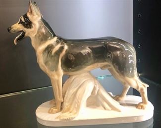 This is a porcelain figurine of a German Shepherd by Meissen, from the sought after Pfeiffer Period, hand-painted underglaze in black and brown, with the famous blue cross mark - a collector piece c. 1924-1934, Art Nouveau period, from Germany. (from an on-line description)