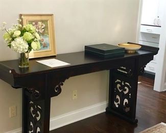 Console Table or buffet with carved legs.