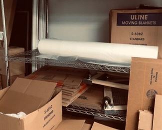 Sorry for the boxes in this photo, but they are covering up most of a really nice stainless steel shelving unit that you usually see in restaurants - beautiful shelving that would be perfect for your garage or basement for storage.