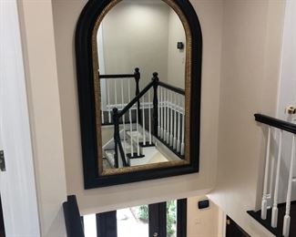 This is quite the large mirror, but it is for sale! Definitely will need to be removed by professionals.