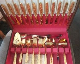 Gold plated flatware in case