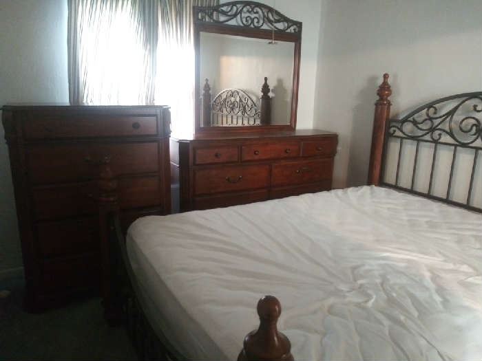 Wyatt by Ashley Furniture. Sells for $2500 without mattress and box springs. Asking $500 for all. Solid wood dresser with mirror, chest, queen headboard footboard, nightstand, very good mattress and box springs. 