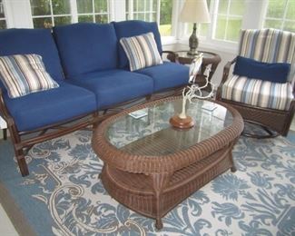 RATTAN SOFA, CHAIR/ROCKER MATCHING END TABLE AND COCKTAIL TABLE AND RUG
