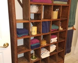 Very charming vintage rack/bookcase...holds anything!