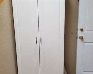 White wood cabinet with inner shelves