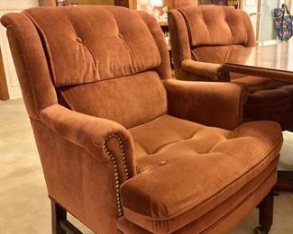Comfy, upholstered arm chair on wheels