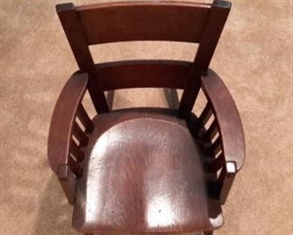 Small child's wood rocker with arms