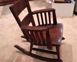 Small child's wood rocker with arms