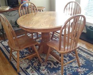 Pedestal oak table and four chairs