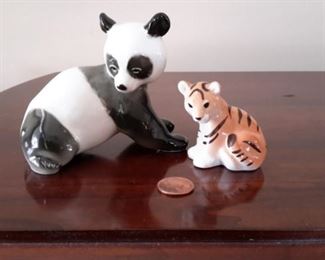 Russian Lomonosov panda and tiger figurines.