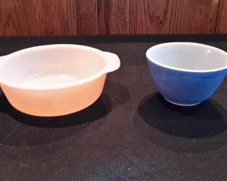 Vintage Fire King peach lustre casserole dish and Pyrex blue mixing bowl.