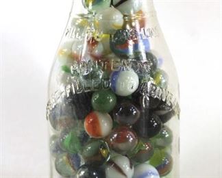 vintage marbles in a milk bottle