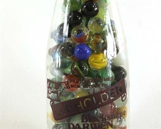 vintage marbles in a milk bottle
