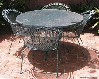 One of Two Outdoor Tables and Chairs