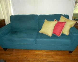 Denim blue colored sofa