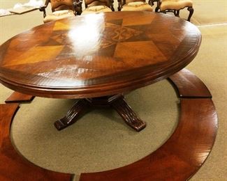 2nd matching table shown un expanded also with 8 chairs leather and sued with hand stitched design