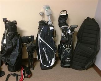 other golf bags some with clubs includinga big bertha