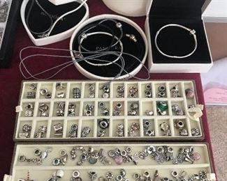 Pandora sterling silver charms, bracelets and necklaces. Charms being sold by the piece.....just like downtown!