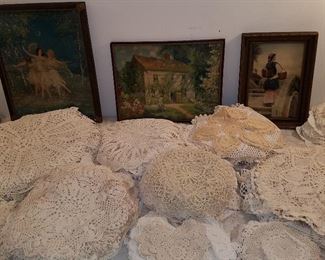 Stacks of lace doilies, Vintage prints in frames
