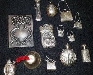 Sterling items including match safe, needle case, thimble holder, perfume bottles, etc.
