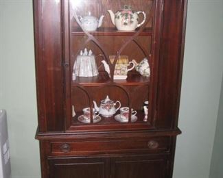 Small china cabinet and teapots