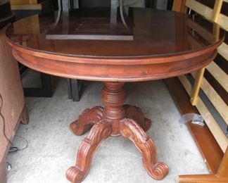 pedestal table with glass for top