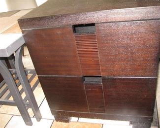 nightstand-looks lighter because of lighting in the storage unit