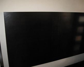 King headboard. It's a dark brown like dresser and nightstand