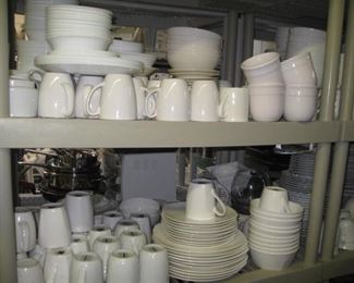 Lots of sets of white dishes