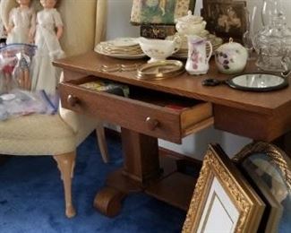 an oak library table with drawer. victorian photo album on brass stand. tilt frame, mirror, ohio art cupid pair. a nice frame and an ornate gold round mirror. Barbie and Ken (circa 63-64) with original barbie marked clothing. clean, ironed and ready. cobalt blue glass pieces.