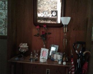 vintage hall table, frames, vintage lamp, umbrellas and canes