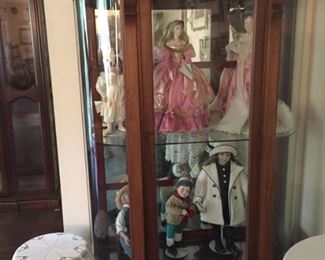 Curio cabinet and doll collection
