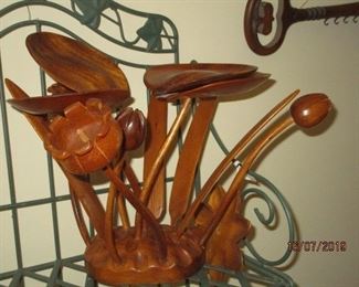 lots of wood carved figurines and decor