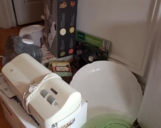 More depression glass, milk glass various housewares including an electric teapot, a mandoline, a FoodSaver with lots of bags