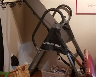 An inversion table to help your back and to freak your neighbors out if you put it in the garage and hang around on summer evenings