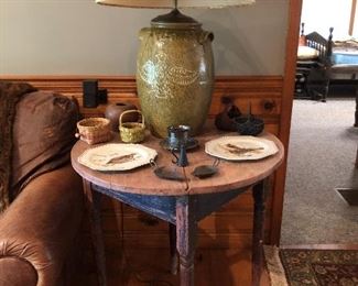 Pottery lamp with Eagle 1876 on one side and flowers on the other, collection of miniature baskets, pair of Betty lamps, round primitive taable with original paint