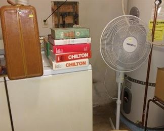 Wash Room Right:  Suitcase, Chilton Books, Fan, Washer/ Dryer,