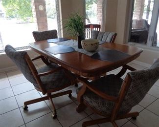 dining table w/4 chairs on roller & leaf