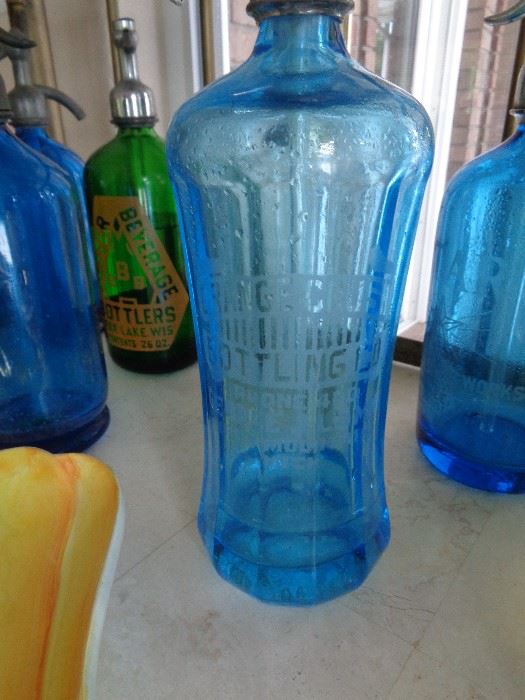 love this collection of vintage seltzer bottles