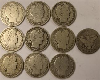 Several Barber half dollar coins