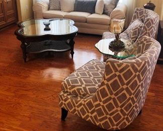 Tones of gray and a beautiful creamy white; sofa, coffee table and pair of occasional chairs.