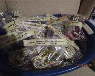 Bags and bags of jewelry.  Many, Many sparkly necklaces, clip earrings, and bracelets.  Also, bags of broken or mismatched pieces for crafting!