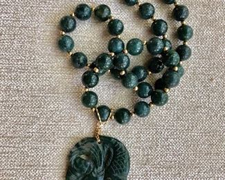 Jade beaded necklace and fish pendant