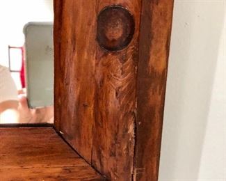 Detail of wood antique mirror