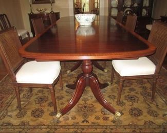 ANTIQUE TRIPLE PEDESTAL TABLE WITH 3 LEAVES AMD PADS SEATS 14 OR MORE  THIS PICTURE HAS ONE LEAF IN THE TABLE     A SHERATON MAHOGANY TABLE FULLY EXTENDED 16FT BY 47 IN