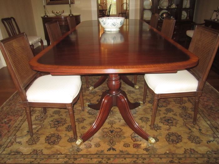 ANTIQUE TRIPLE PEDESTAL TABLE WITH 3 LEAVES AMD PADS SEATS 14 OR MORE  THIS PICTURE HAS ONE LEAF IN THE TABLE     A SHERATON MAHOGANY TABLE FULLY EXTENDED 16FT BY 47 IN